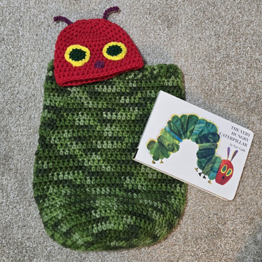 Crocheted baby wrap and hat to look like the Very Hungry Caterpillar